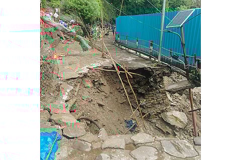 A damaged road at Junglechatti after Cloudburst